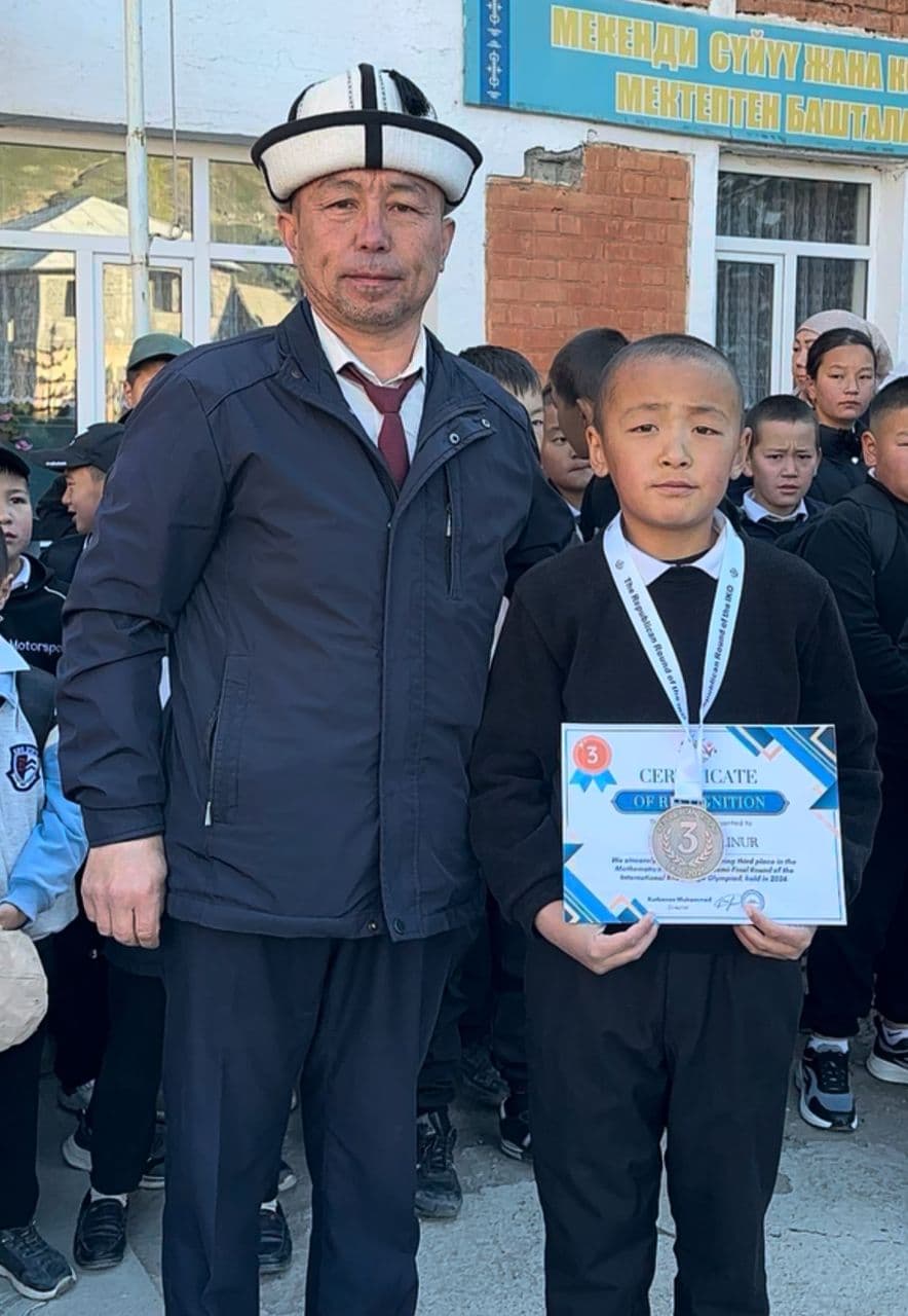 Director with a medal-winning student